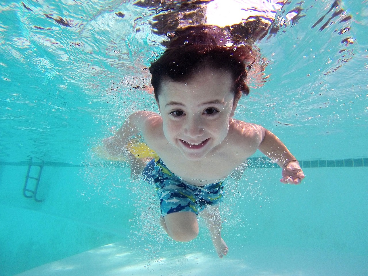 happy kid swimming
